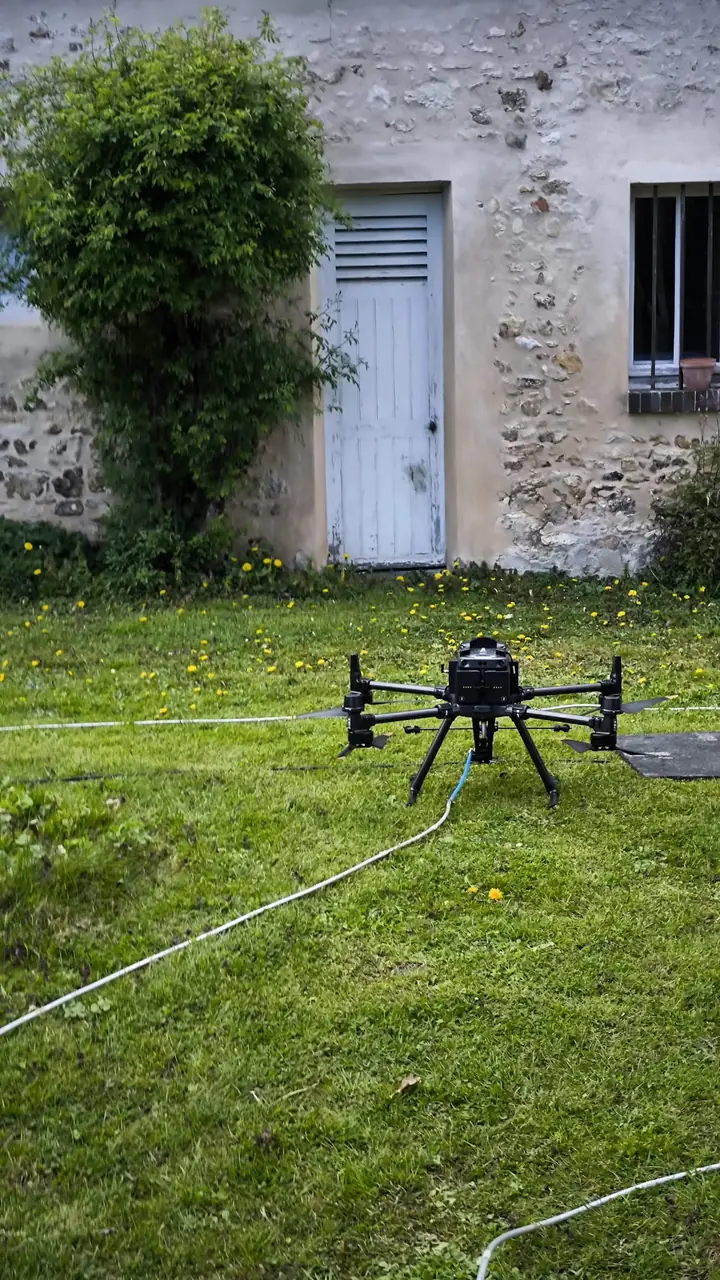 Drone on a lawn before a roof job